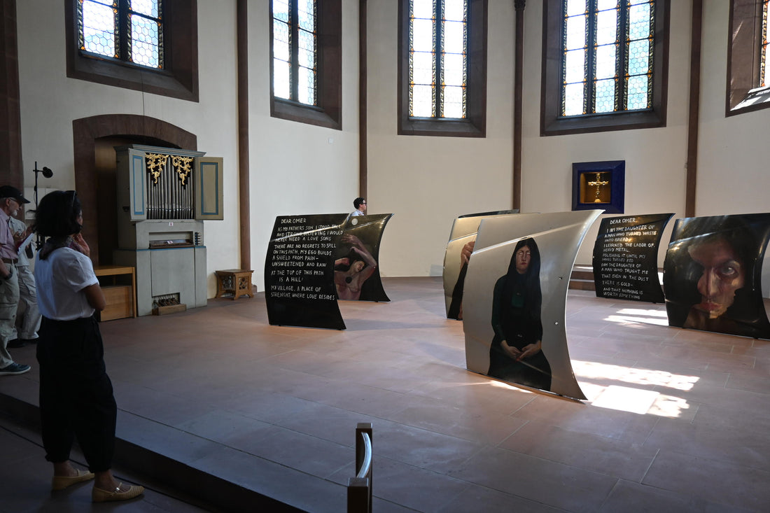 Selma Selman's Vale installation at Art Basel 2025 Parcours, large curved portrait panels in a church interior, by a Frieze London 2026 Code Universe artist exploring mass culture in contemporary art
